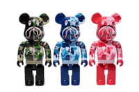 three bearbrick figures in camouflage outfits