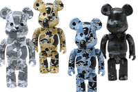 four bearbrick figures in different camouflage colors